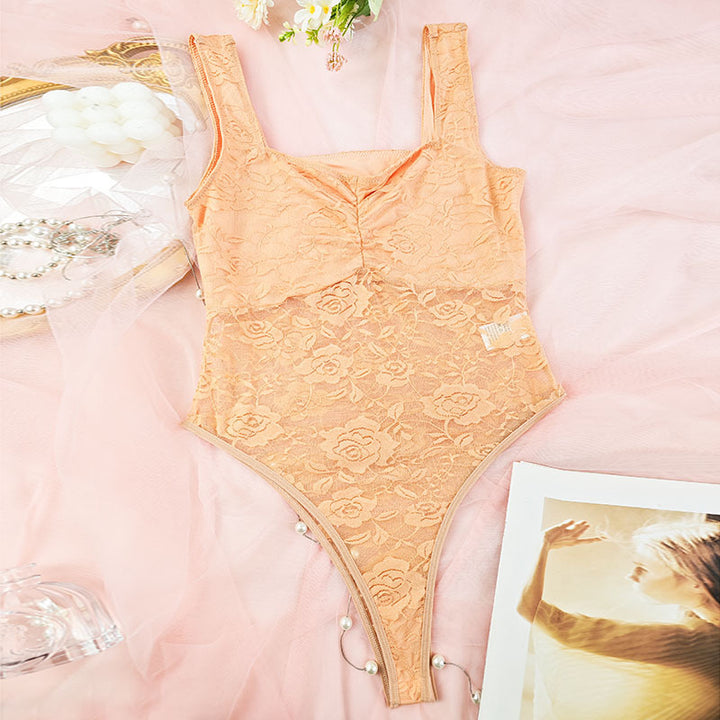 Dame spids-bodysuit med floral design og konturerende snit Stilla