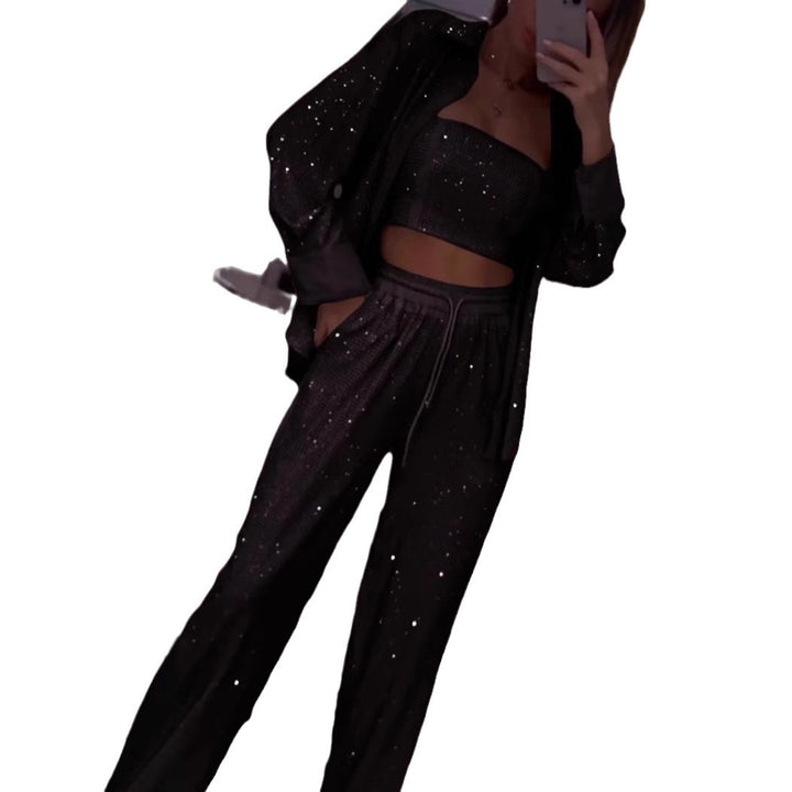 Dame fritids-loungewear sæt med glitrende top og elastiske bukser Stilla