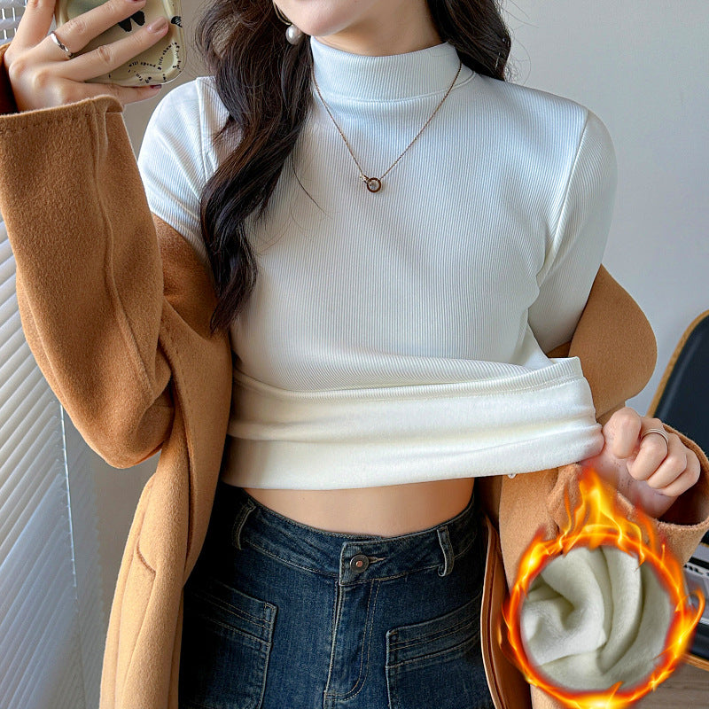Kvinders langærmet cropped top med høj krave og ribbet tekstur Stilla