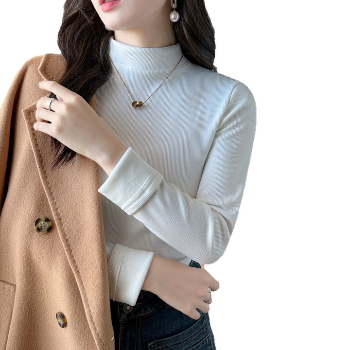 Kvinders langærmet cropped top med høj krave og ribbet tekstur Stilla