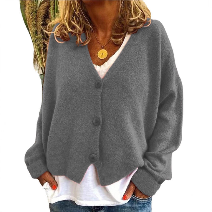 Dame hovedbeklædning med oversized snit og knapdetaljer Stilla