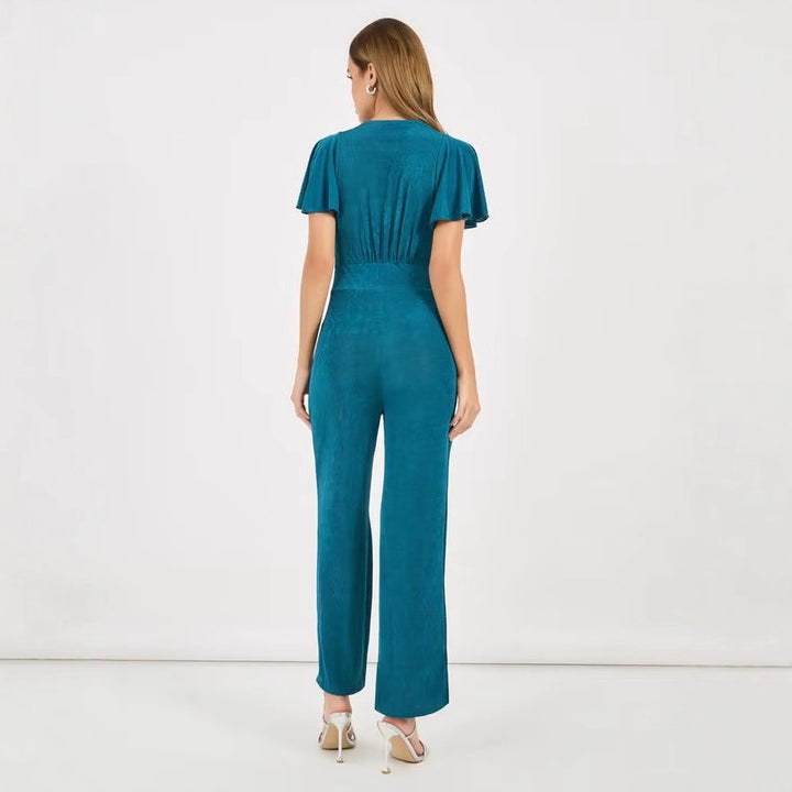 Dame elegant jumpsuit med flydende snit og detaljerede puffærmer Skovae