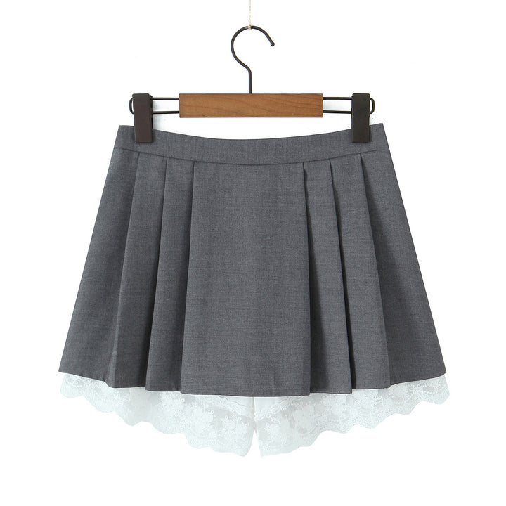 Dame plissee-nederdel med elegante spidsaksepter og asymmetrisk kant Stilla