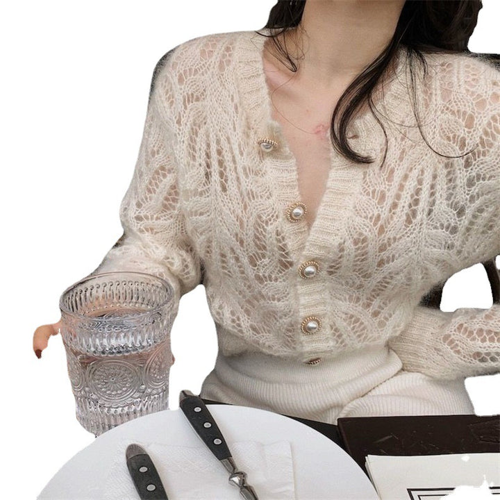 Kvindernes cardigan med åbent mønster og elegante knapdetaljer Stilla