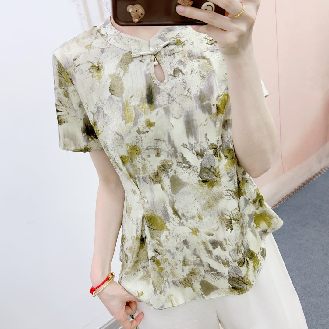 Dame bluse-bukse-sæt med floralt design og elegante detaljer Stilla