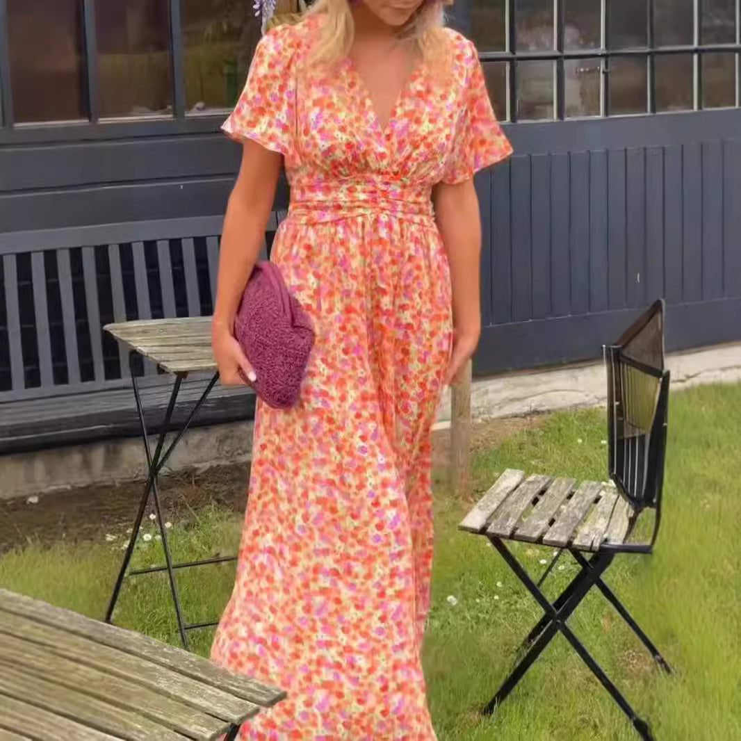 Dame maxikjole med elegant blomsterdesign og dyb V-udskæring Stilla