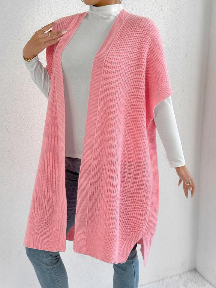 Dame strikjakke i afslappet oversized stil med åben front og sideslids Stilla