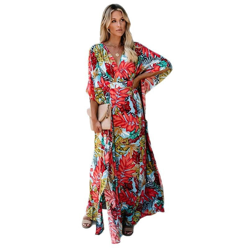 Dame Maxikjole med dyb V-udskæring og elegante flapærmer Stilla