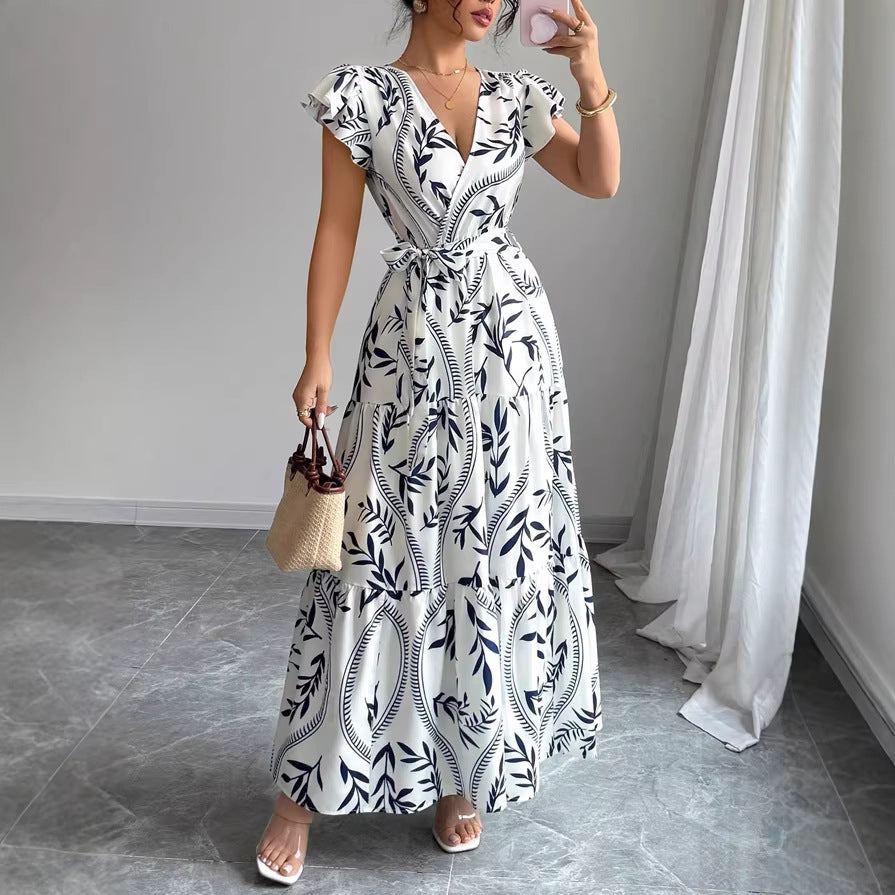 Dame maxikjole i boho-inspireret design med blomster-elementer og taljerbar bælte Skovae