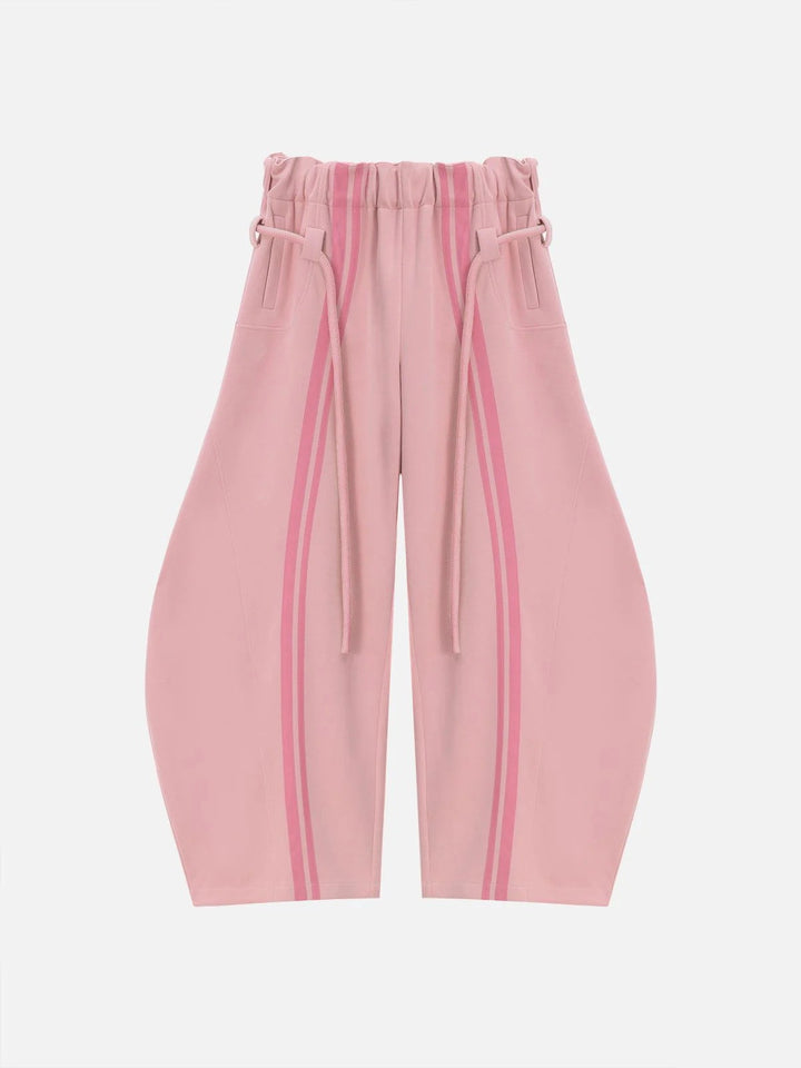 Dame casual bukser i sporty design med kontrasterende striber og elastisk talje.