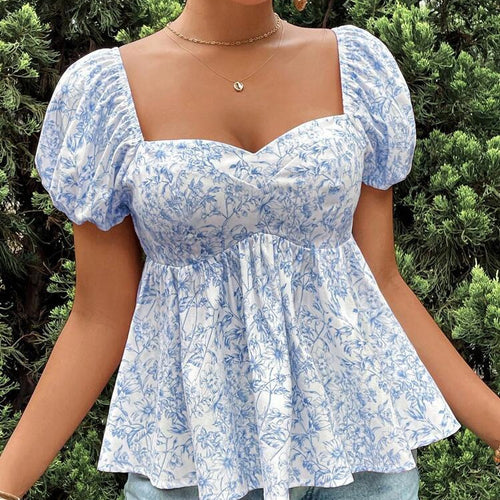 Damebluse med puffærmer og blomsterdesign Stilla