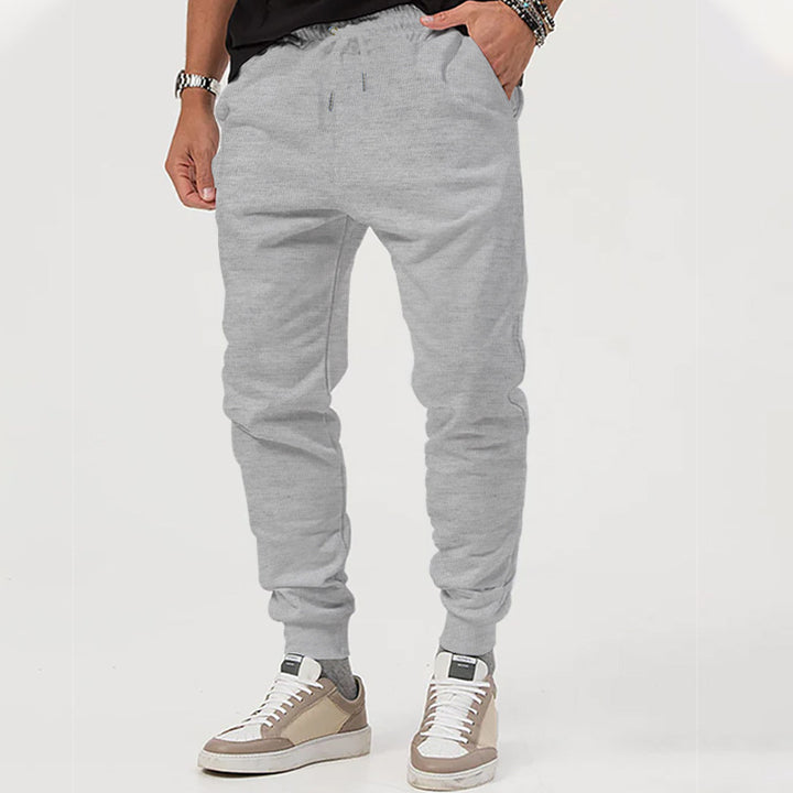 Herre nan Jersey-sweatpants i konisk snit med skjult snor og formstabile fodbånd Skovae