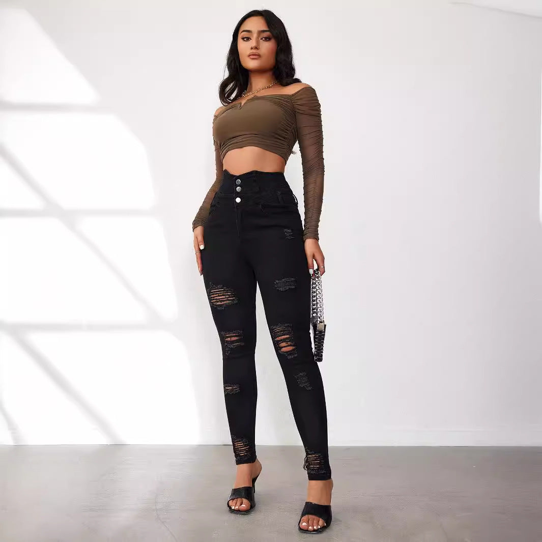 Dame Højtaljede Skinny Jeans i moderne Destroyed-look med knapdetaljer Stilla