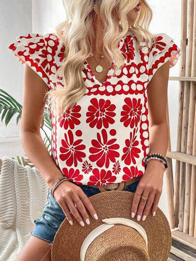 Damebluse med florale flæsedetaljer og frisk design Stilla