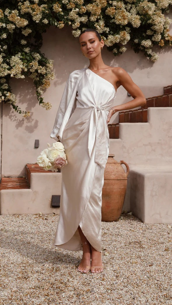 Ladies wrap dress with asymmetric design and elegant waist belt Skovae