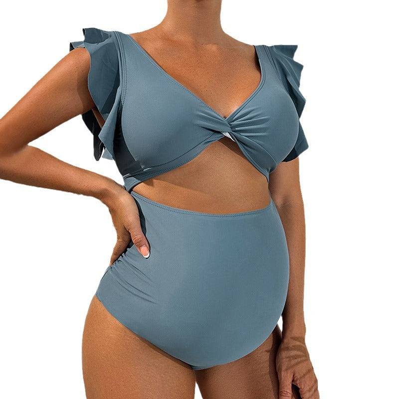 Dame ensfarvet badedragt med voluminøse rynkedetaljer og moderne cut-out Stilla