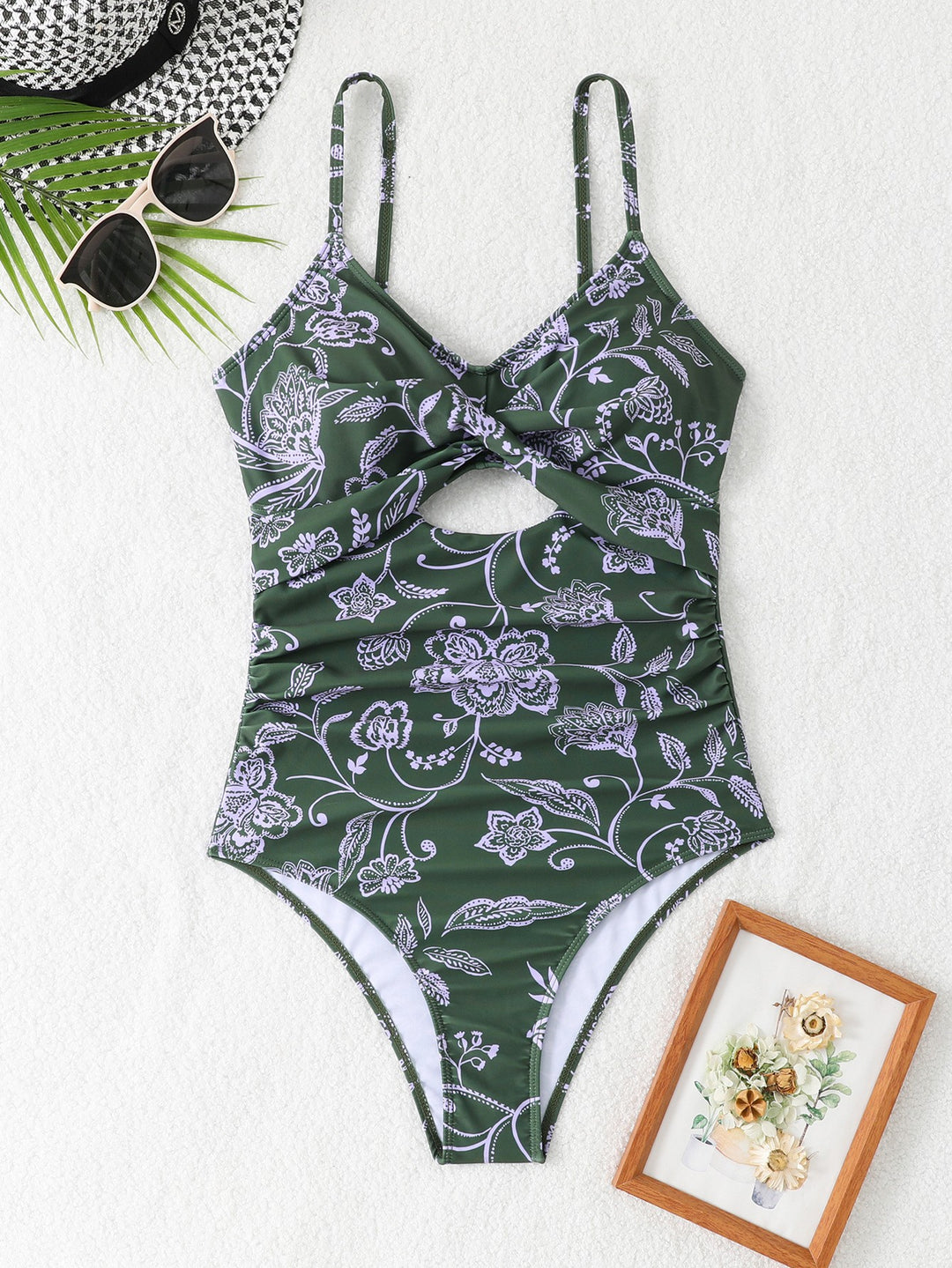 Dame ensartet badedragt med blomstret design og raffineret cut-out Stilla