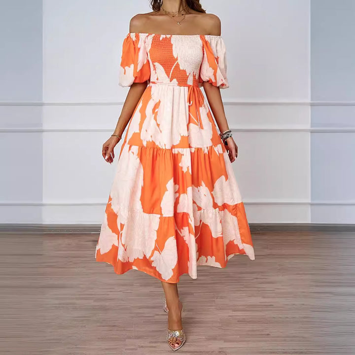 Dame sommerkjole med elegant puffærme-design og floralt mønster Stilla