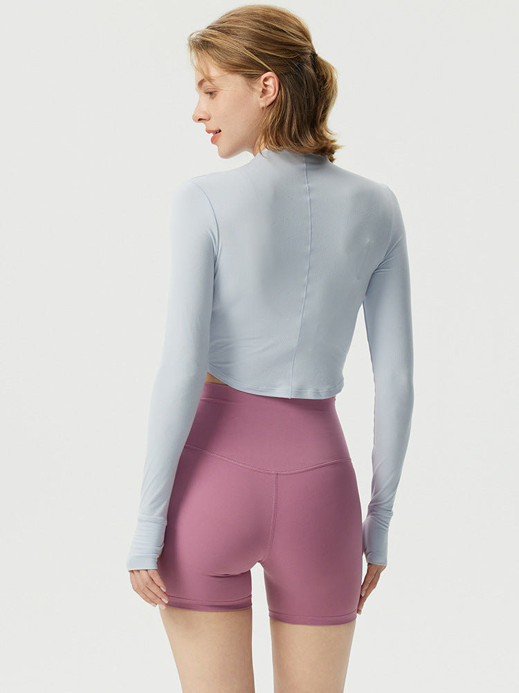 Dame sporty langærmet crop top med høj krave og åndbar struktur Stilla