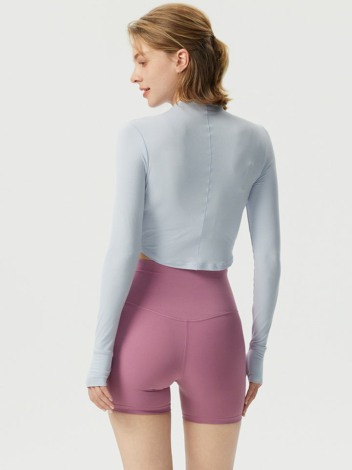 Dame sporty langærmet crop top med høj krave og åndbar struktur Stilla