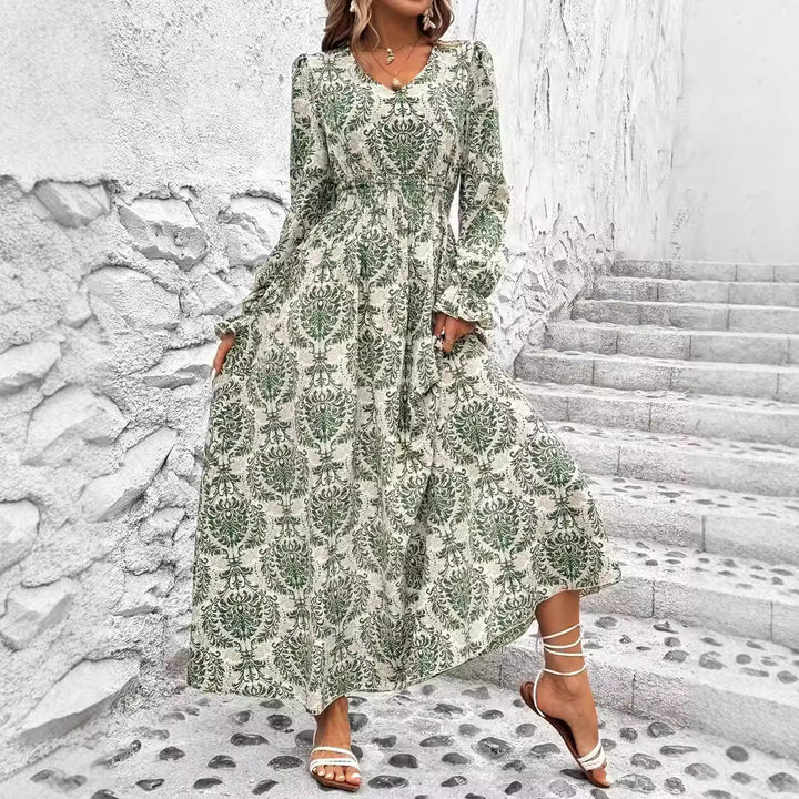 Dame Maxikjole med floralt design og vidde skørt Stilla