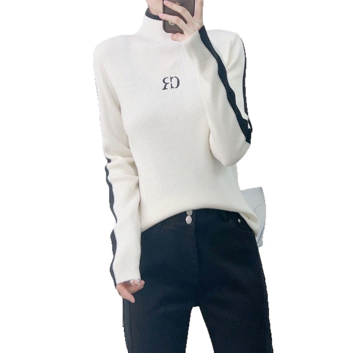 Dame elegant rullekrave sweater med kontrastærmer og moderne design Stilla