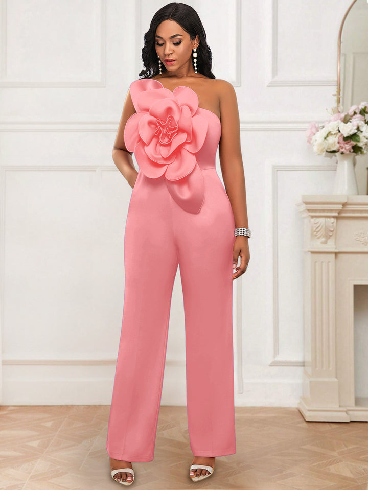 Dame elegant overall med stort blomsteraccent Skovae