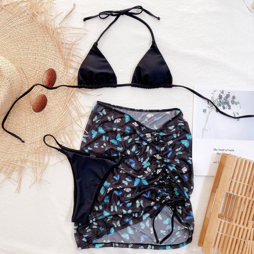 Dame Triangel-Bikini med transparent Wickel-Rock-Optik og farverigt sommerfuglemønster Stilla