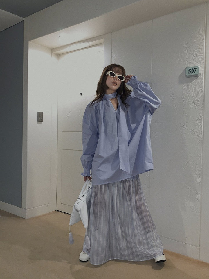 Dame Oversized Bluse med gennemgående indpakningsdesign og elegante detaljer Stilla