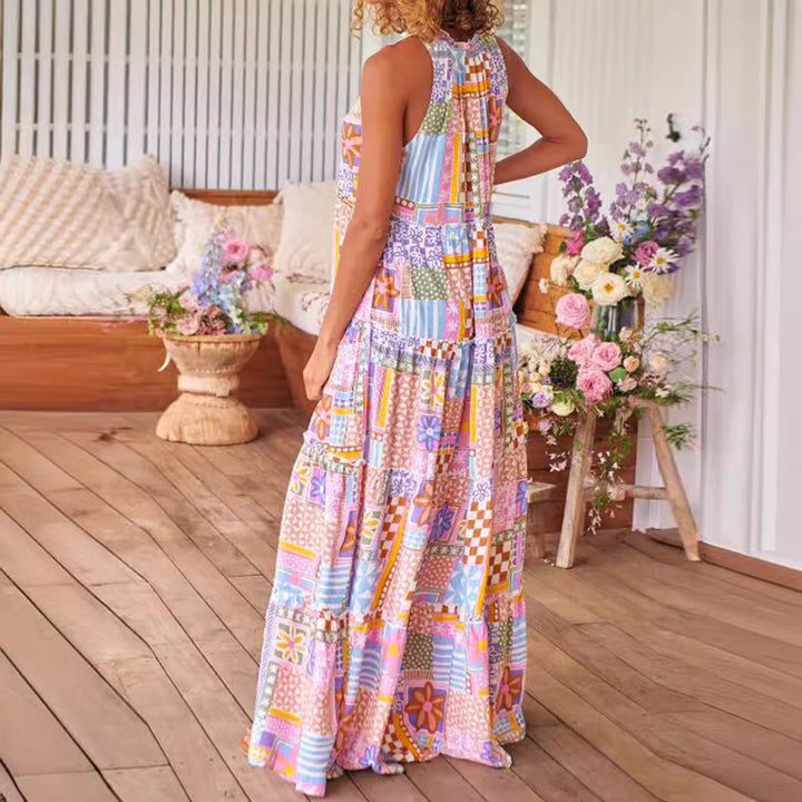 Dame maxikjole med farverigt patchwork-design og flæser Stilla