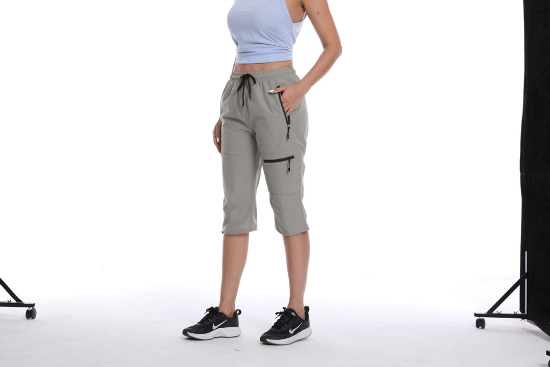 Dame Funktionelle Sports Capri Bukser med Praktiske Lynlåslommer Stilla