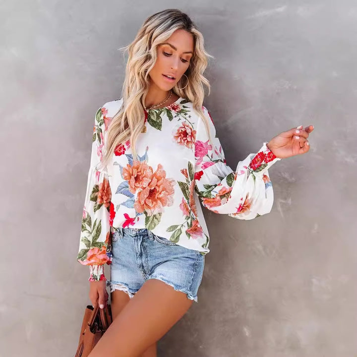 Damebluse med voluminøse ærmer og floral mønster Stilla