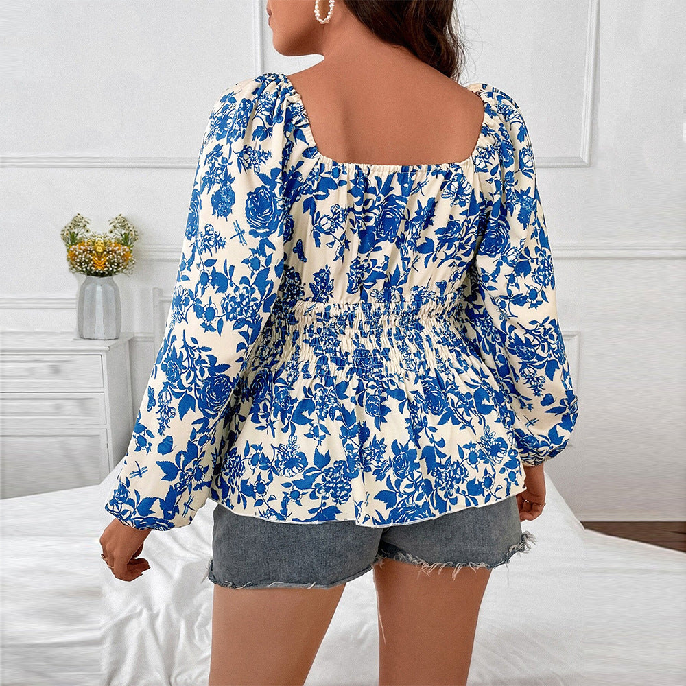 Damebluse med elastisk indsats og blomsterdesign Stilla