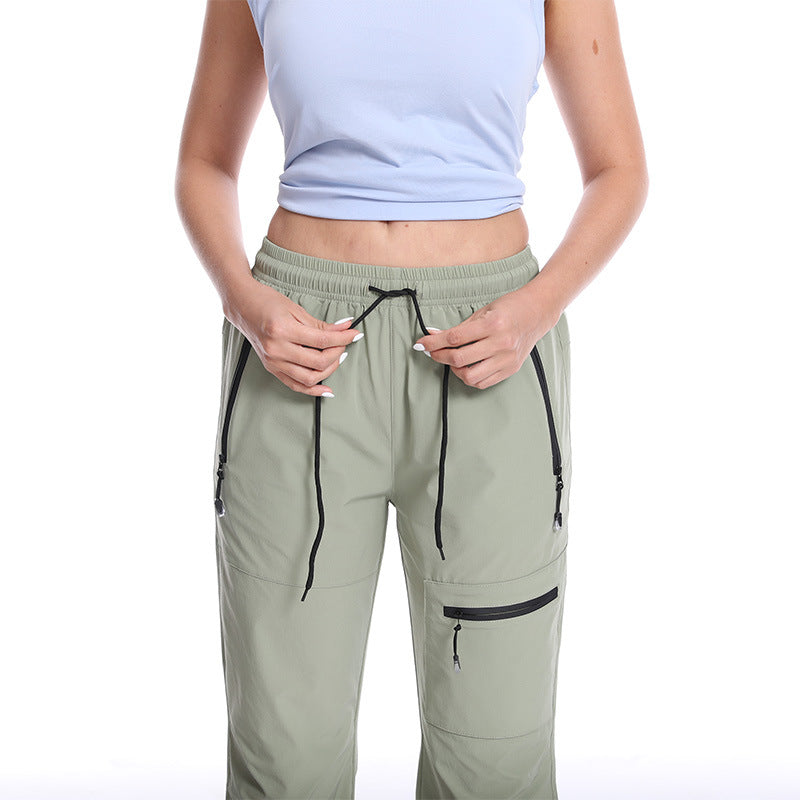 Dame Funktionelle Sports Capri Bukser med Praktiske Lynlåslommer Stilla