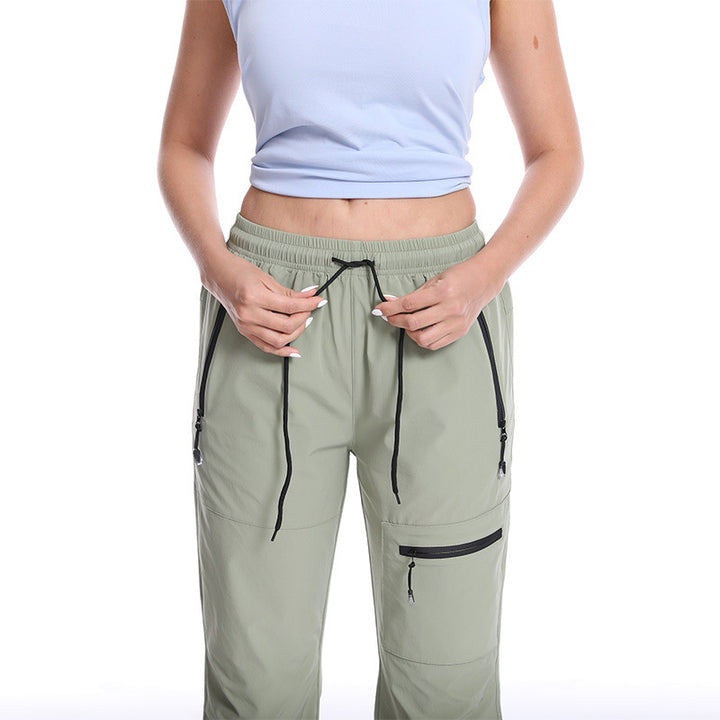 Dame Funktionelle Sports Capri Bukser med Praktiske Lynlåslommer Stilla