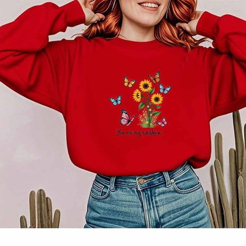 Damebluse med blomstermotiv og motiverende print Stilla