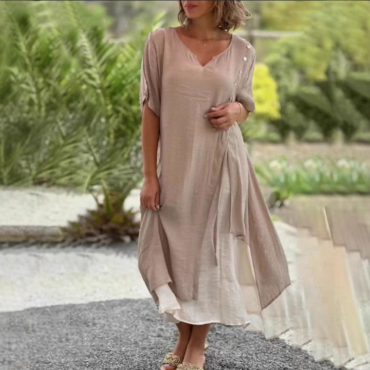 Dame Strandkjole med asymmetrisk snit og elegante knapdetaljer Stilla