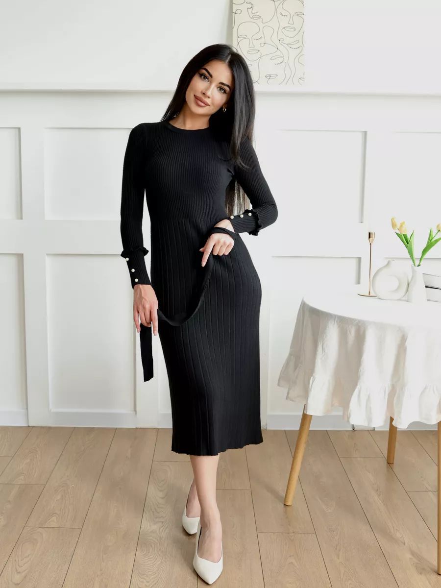 Dame finstrik kjole med elegant ribstruktur og fashionable ærmeaccentuer Stilla