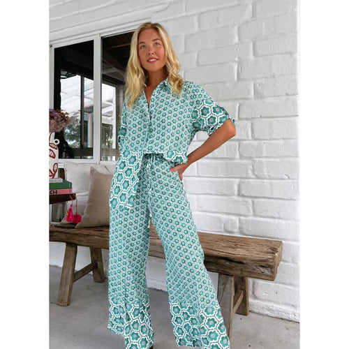 Kvinders chikke bluse-bukser kombination med blomsterprint og løs pasform