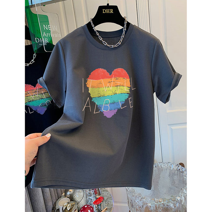 Dame T-shirt med kreativt regnbueskærtsmotiv og inspirerende skrift Stilla