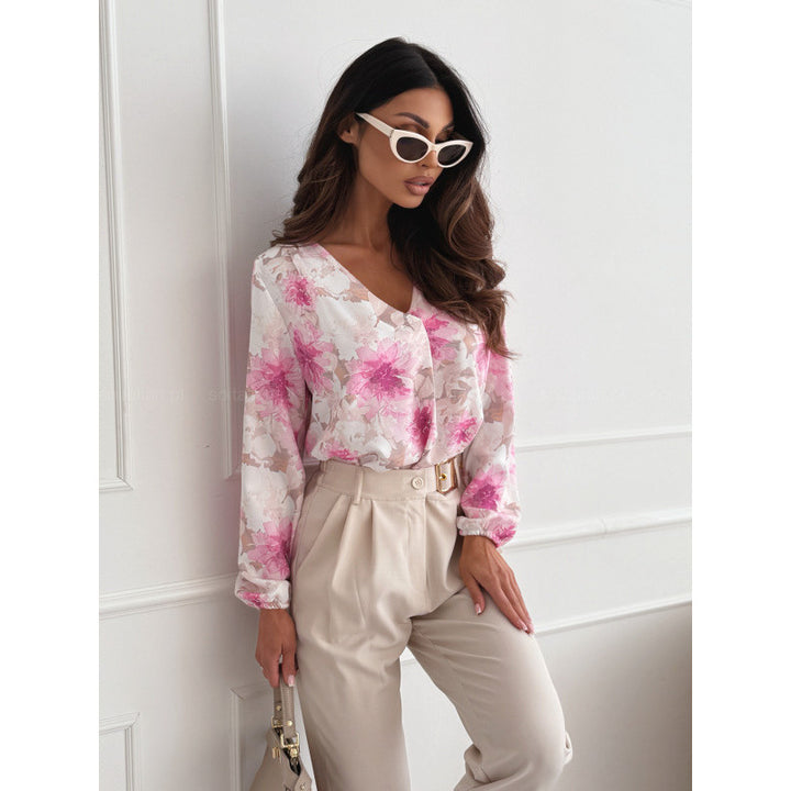 Damebluse med blomsterprint og elegante pufærmer Stilla