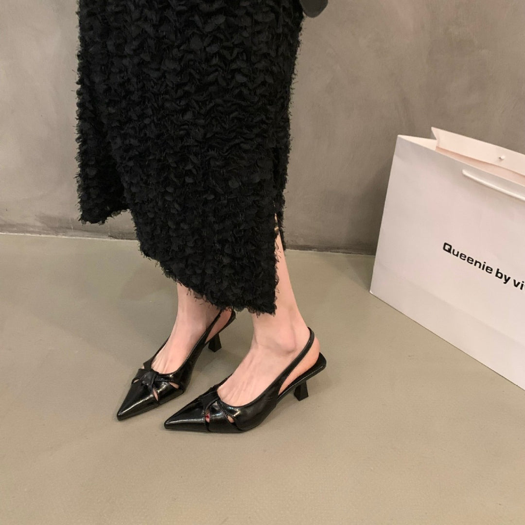 Dame Slingback-pumps med spids tåområde og dekorativt sløjfedesign Stilla