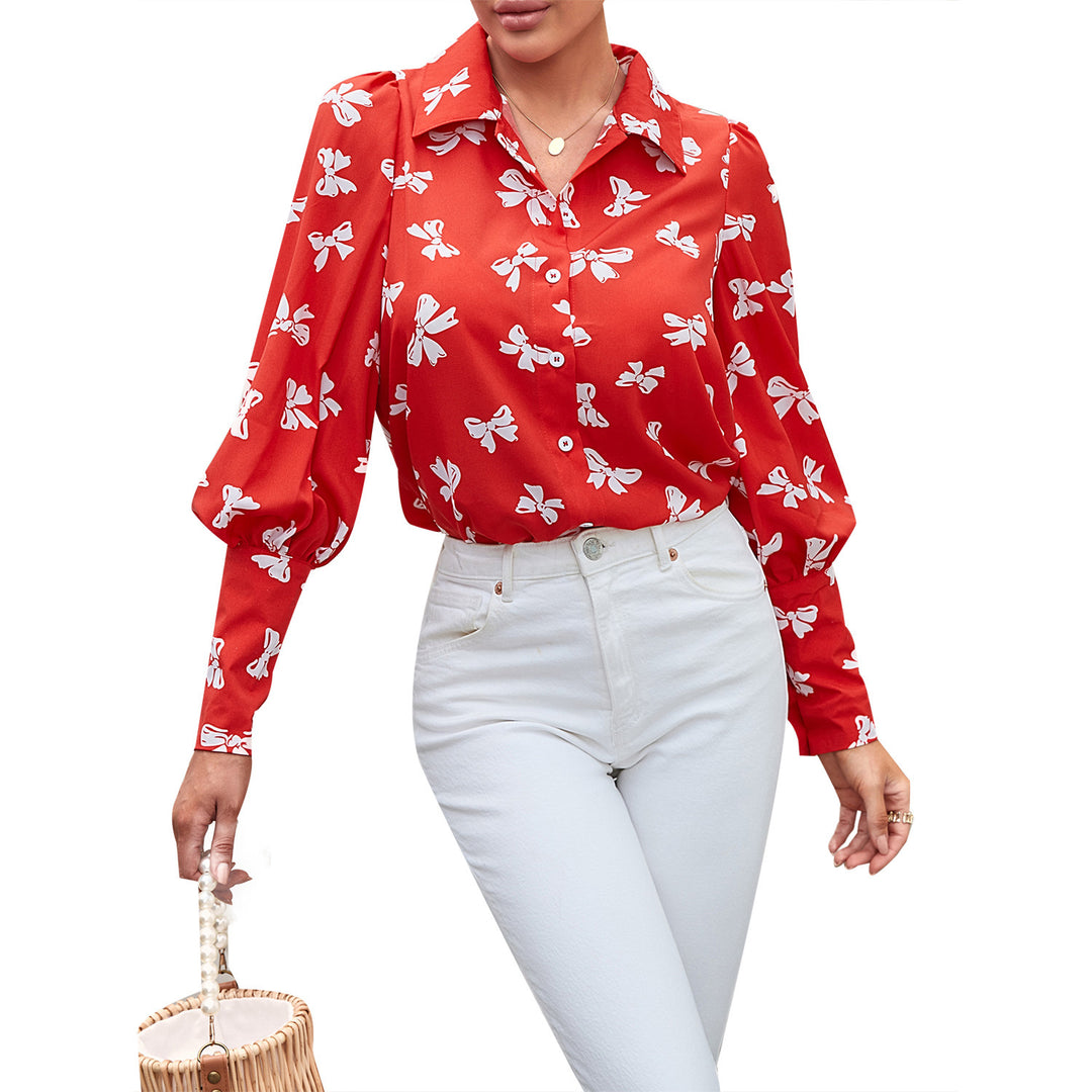 Kvindernes elegante bluse med blomsterprint og pufærmer Stilla