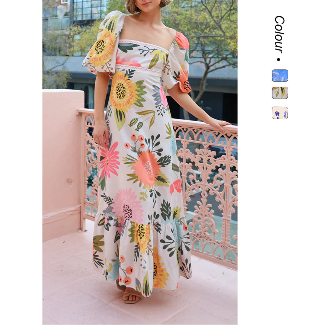 Dame maxi kjole med elegante pufærmer og blomstrede accenter Skovae