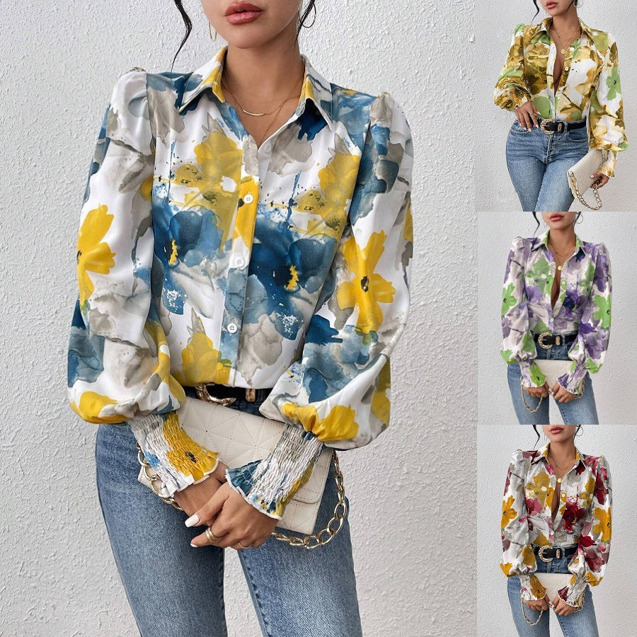 Dame elegant bluse med farverigt floralt design og afslappede puffærmer Stilla