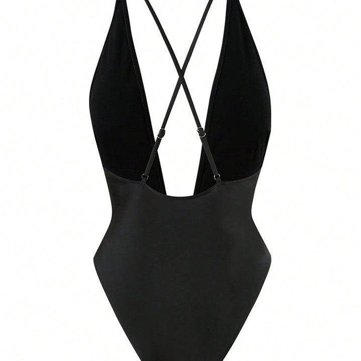 Dame étone badedragt med dyb V-udskæring og elegant smykkeelement Skovae