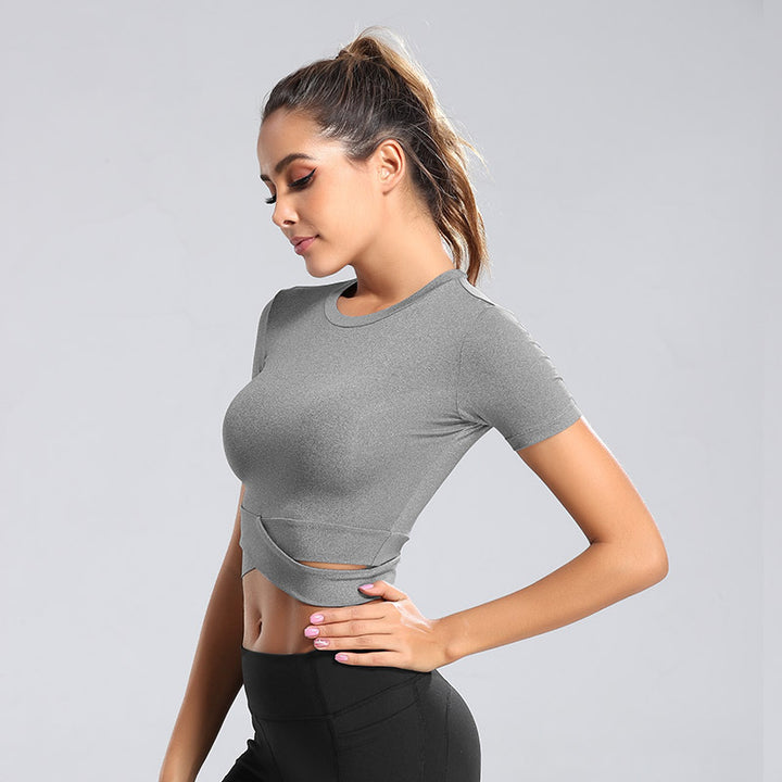 Dame kortærmet træning crop top med innovativ indpakningsoptik Skovae