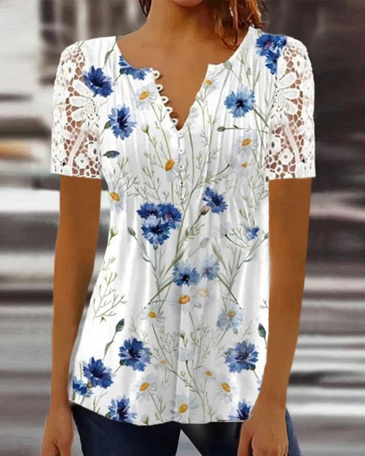Damebluse med spidse ærmer og blomsterdesign Stilla