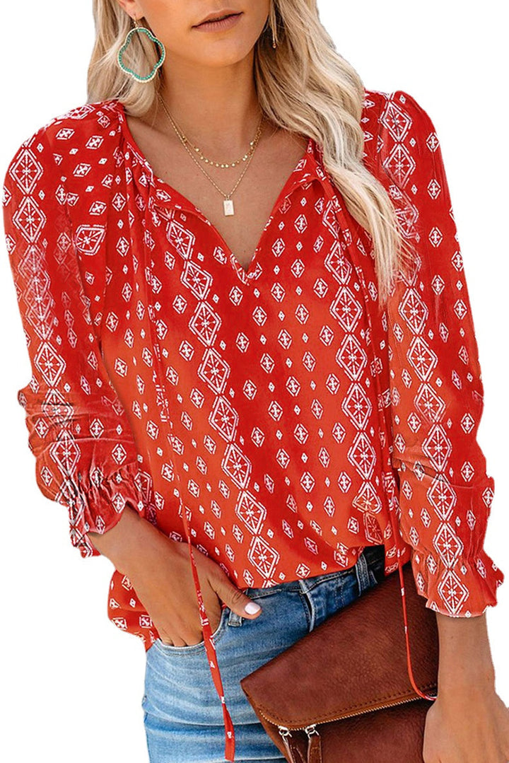 Damebluse med blomsterdesign og løse ærmer Stilla