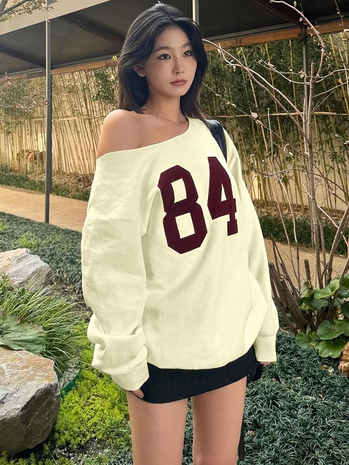 Dame Oversized Sweatshirt med stilfuld Cut-Out-design og sporty tryk Stilla